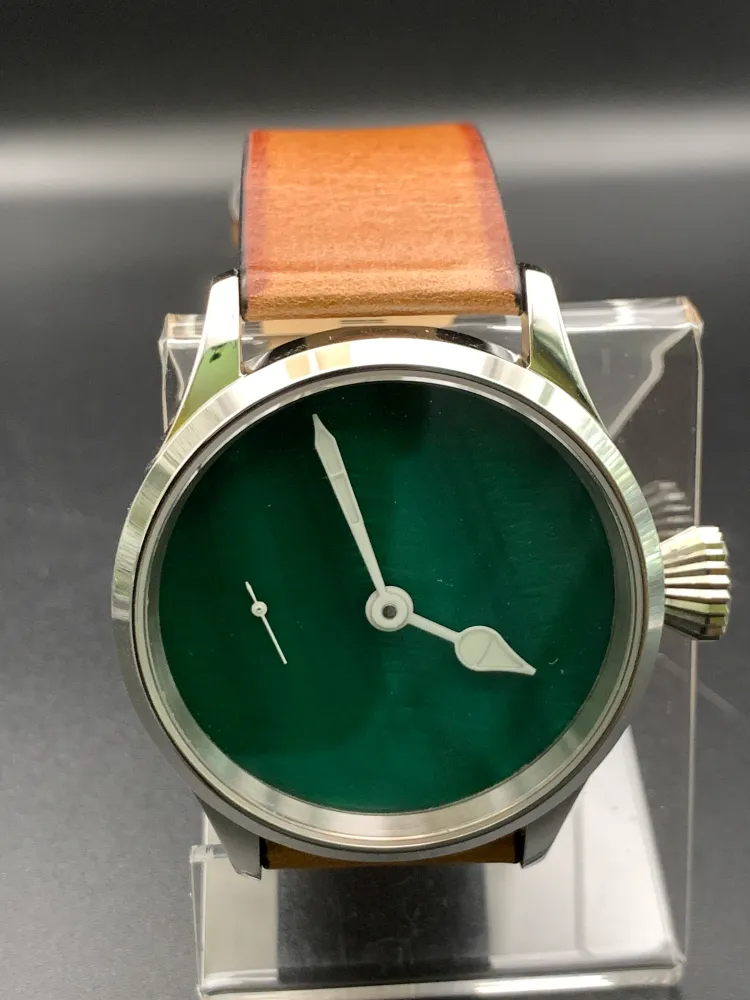 ‘Sold - 42mm Dark green mother of pearl. Swiss movement.