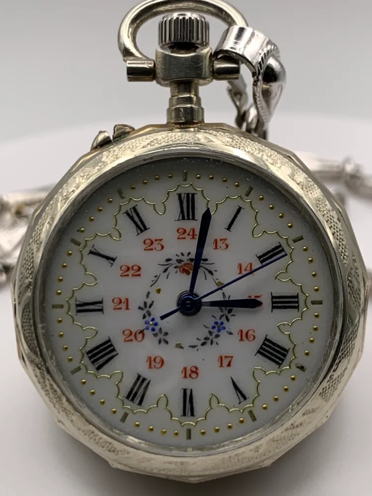 Amuse-bouche. 30mm pocket / necklace watch. NOS Argentan alloy case and hand painted enamel dial. Sapphire crystal. Miyota 2036. 24” sterling necklace.
