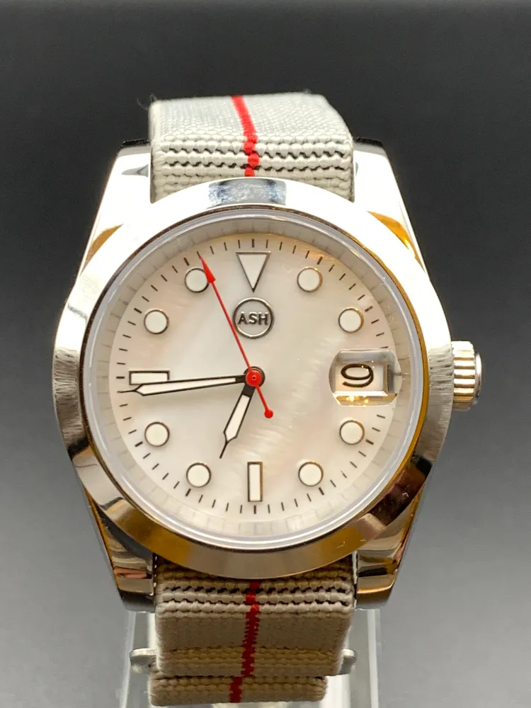 Touch of Red. 39mm Stainless Steel. Mother of Pearl. NH35 automatic. Date magnifier.